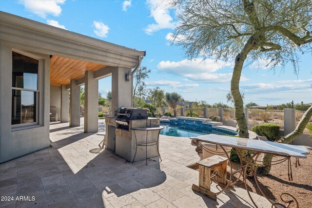 view of swimming pool featuring a patio and area for grilling