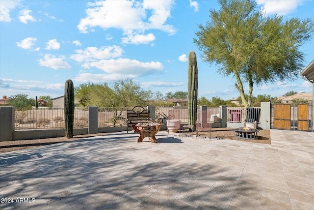 view of patio / terrace with an outdoor fire pit