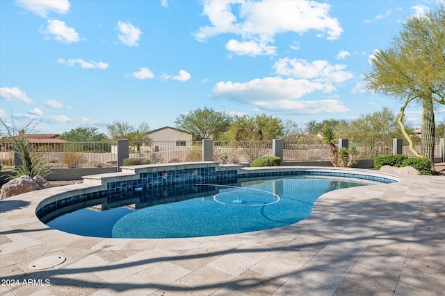 view of swimming pool featuring a patio area