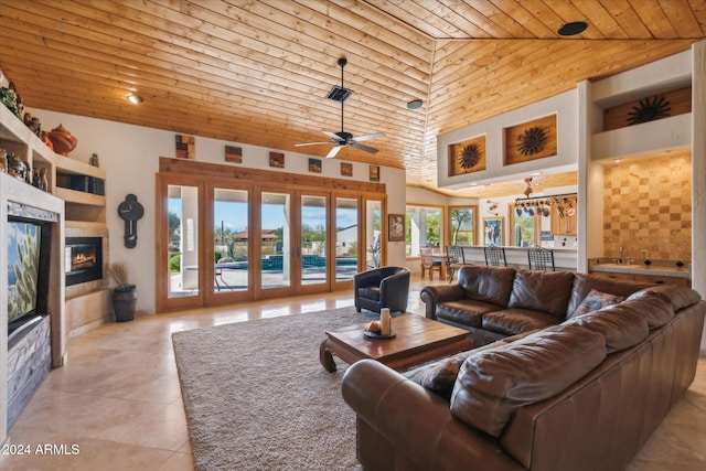 tiled living room with french doors, high vaulted ceiling, ceiling fan, and wooden ceiling