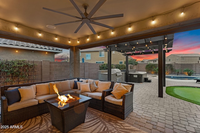 view of patio with an outdoor living space with a fire pit, an outdoor pool, a fenced backyard, and area for grilling