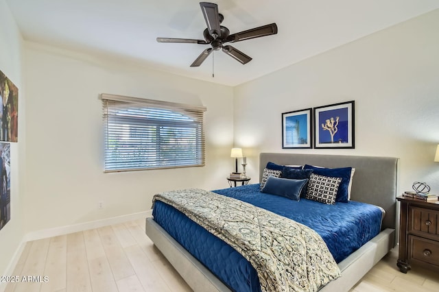 8653 E Royal Palm Rd Unit 1030, Scottsdale, AZ 85258 - bedroom featuring wood finished floors and a ceiling fan