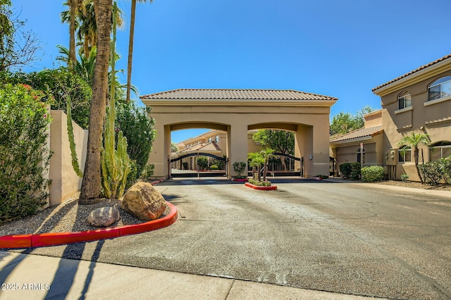 8653 E Royal Palm Rd Unit 1030, Scottsdale, AZ 85258 - view of road with a gate and curbs