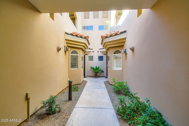 8653 E Royal Palm Rd Unit 1030, Scottsdale, AZ 85258 - view of exterior entry with stucco siding and a tiled roof