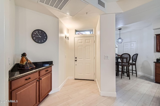 8653 E Royal Palm Rd Unit 1030, Scottsdale, AZ 85258 - entrance foyer with light wood-style floors and baseboards