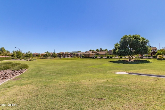 view of property's community with a lawn