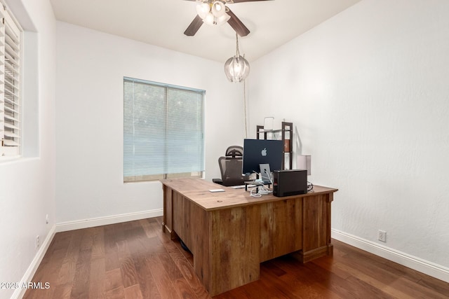 office area with baseboards, ceiling fan, and dark wood-style flooring