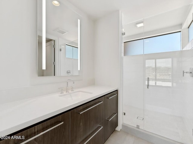 bathroom with vanity and walk in shower