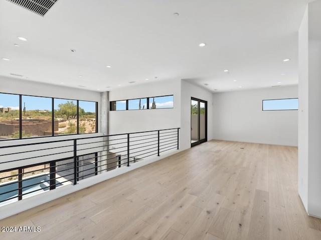 unfurnished room featuring light wood-type flooring