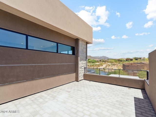 balcony featuring a mountain view