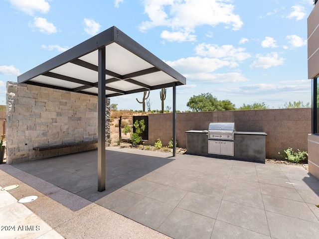 view of patio with a grill and exterior kitchen