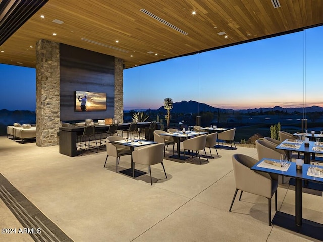 patio terrace at dusk with a mountain view