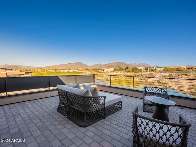 view of patio featuring a mountain view and outdoor lounge area