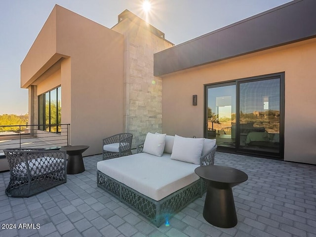 view of patio terrace at dusk