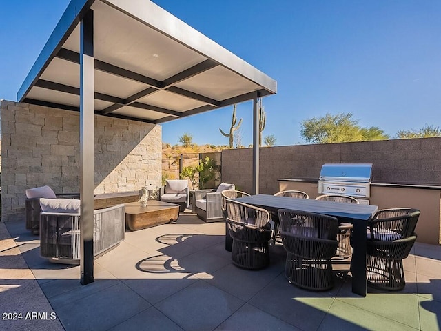 view of patio featuring exterior kitchen and grilling area