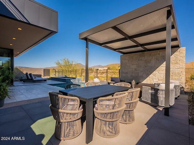 view of patio / terrace with a mountain view