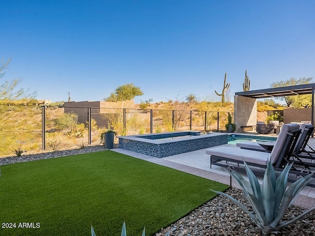 view of yard with a patio area and a swimming pool with hot tub