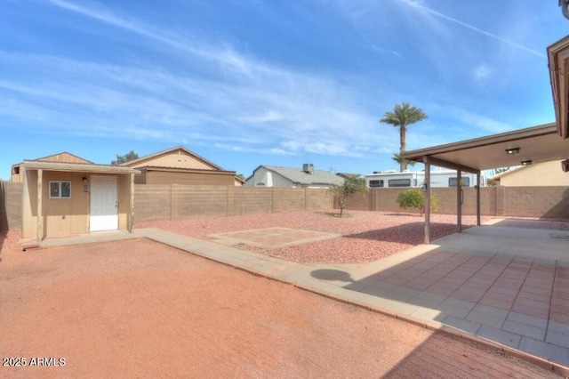 view of yard with a fenced backyard and a patio