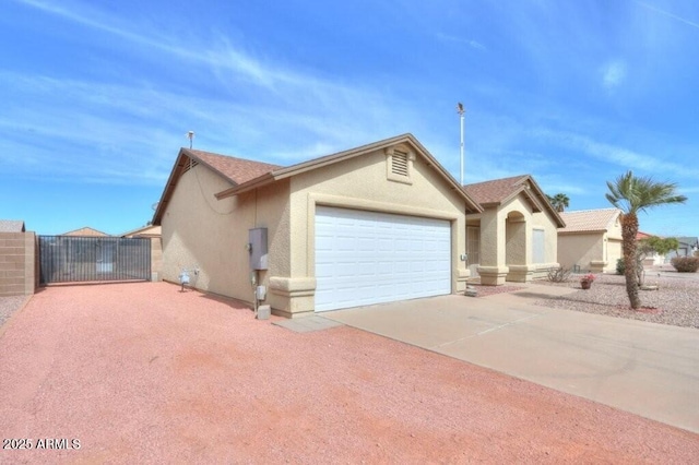 ranch-style home featuring a garage, driveway, a gate, and stucco siding