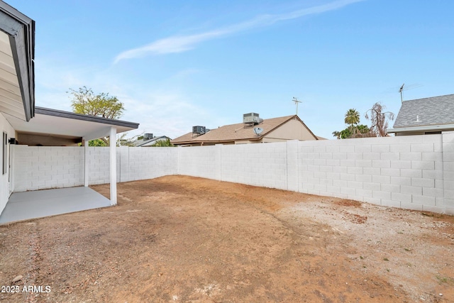 view of yard with a patio area and a fenced backyard