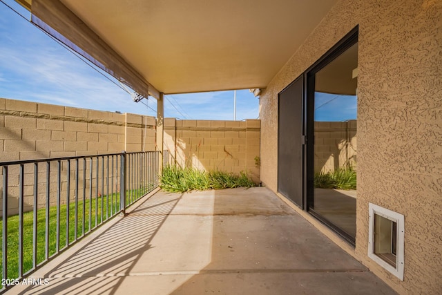 view of patio featuring fence