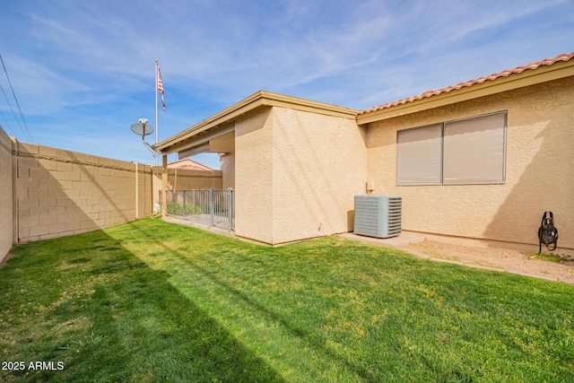 view of yard featuring a fenced backyard and cooling unit