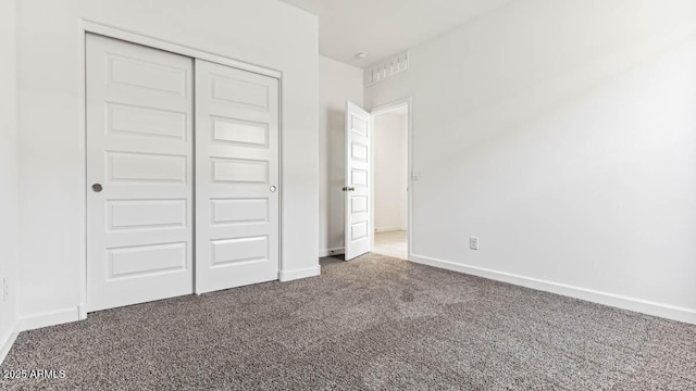 11891 E Cliffrose Ln, Florence, AZ 85132 - unfurnished bedroom featuring carpet floors and a closet