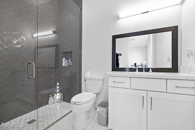 bathroom featuring toilet, a stall shower, tile patterned flooring, and vanity