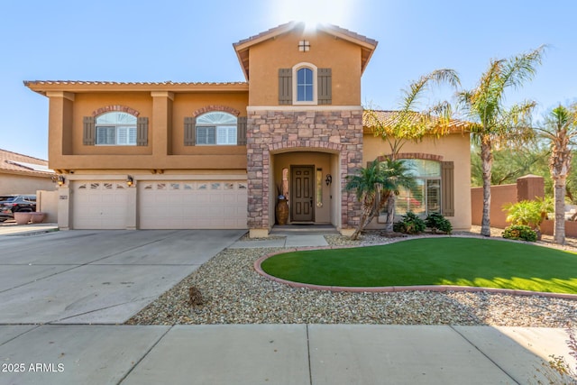 mediterranean / spanish house with a front yard and a garage