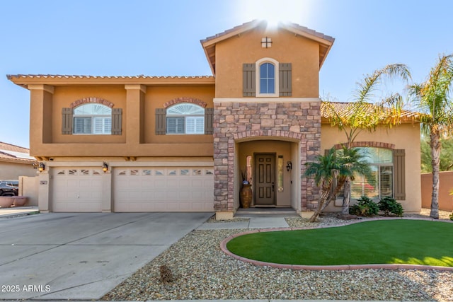 mediterranean / spanish-style house featuring a front lawn and a garage