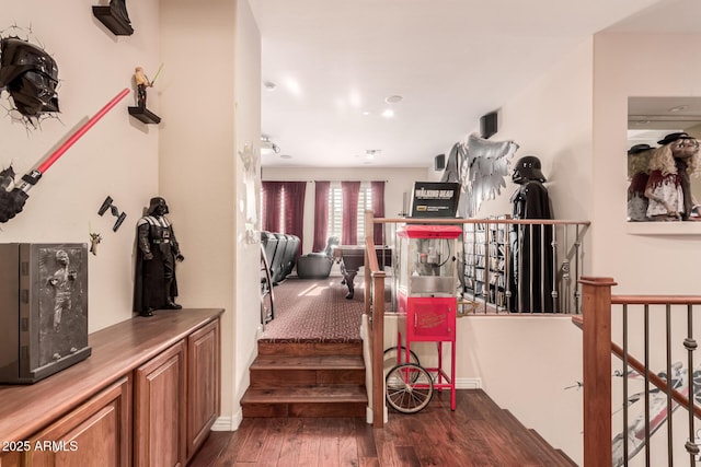 stairway with hardwood / wood-style flooring