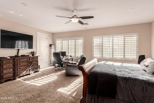 bedroom with ceiling fan and carpet flooring