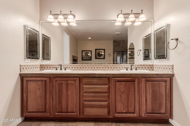 bathroom featuring vanity and decorative backsplash