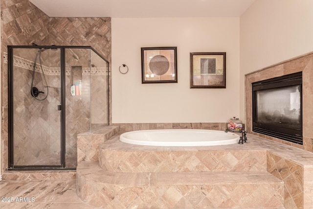 bathroom featuring separate shower and tub