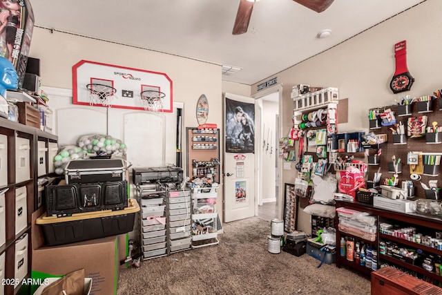 misc room featuring dark carpet and ceiling fan