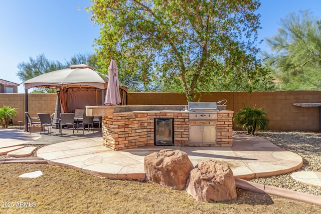 view of patio featuring a gazebo and area for grilling