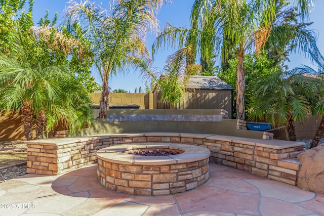 view of patio featuring a fire pit