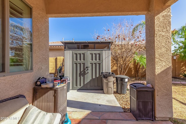 view of patio / terrace with a storage unit