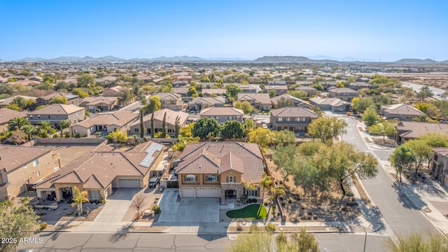 birds eye view of property featuring a mountain view