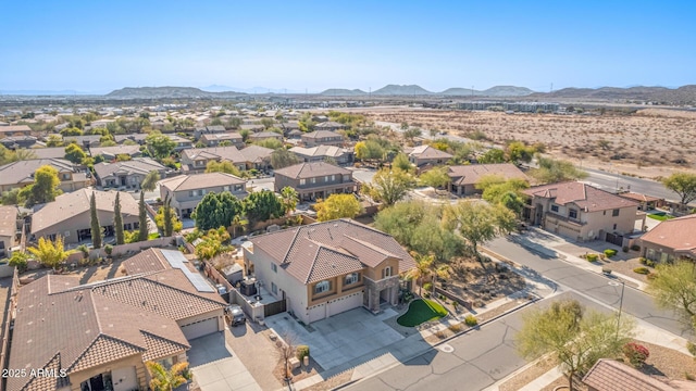 birds eye view of property featuring a mountain view