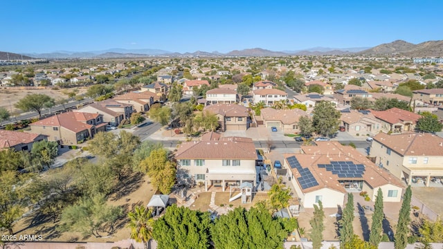 birds eye view of property with a mountain view