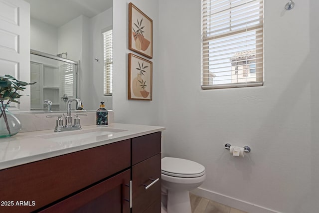 656 S Owl Dr, Gilbert, AZ 85296 - bathroom with plenty of natural light, a shower stall, baseboards, and toilet