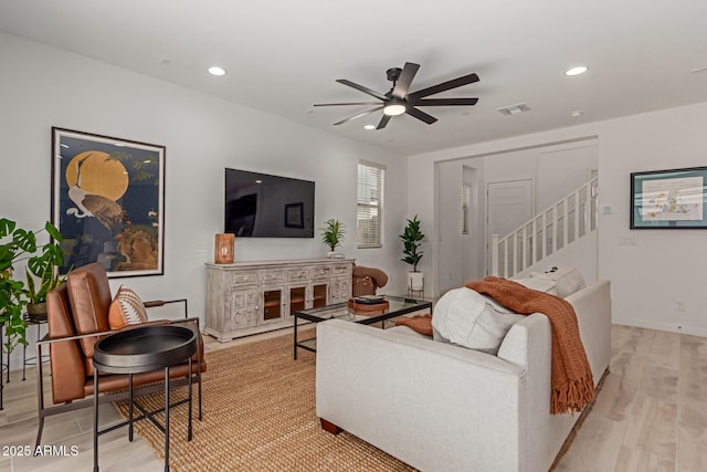 656 S Owl Dr, Gilbert, AZ 85296 - living area with stairs, a ceiling fan, recessed lighting, baseboards, and light wood-style floors