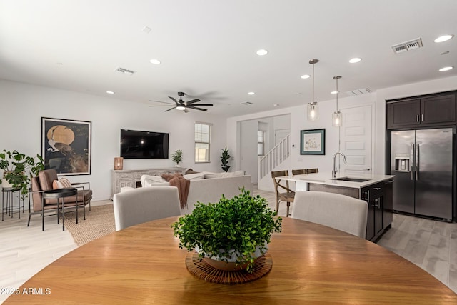656 S Owl Dr, Gilbert, AZ 85296 - dining area featuring stairway, light wood-type flooring, recessed lighting, and a ceiling fan