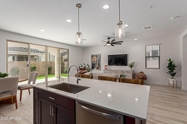 656 S Owl Dr, Gilbert, AZ 85296 - kitchen with a sink, stainless steel dishwasher, decorative light fixtures, open floor plan, and recessed lighting