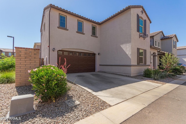 656 S Owl Dr, Gilbert, AZ 85296 - mediterranean / spanish home with an attached garage, stucco siding, driveway, and a tiled roof