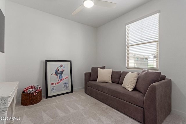 656 S Owl Dr, Gilbert, AZ 85296 - living room with light colored carpet, a ceiling fan, and baseboards