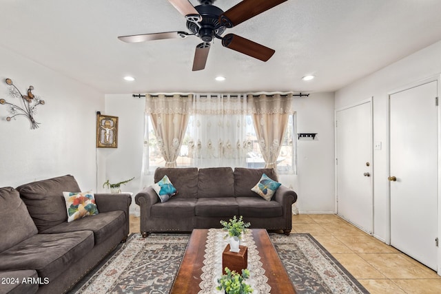 living room with ceiling fan and light tile patterned floors