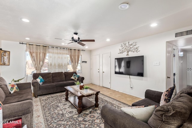 tiled living room featuring ceiling fan