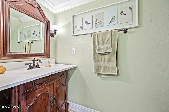 bathroom featuring vanity and crown molding